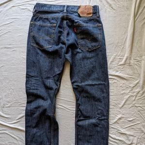 Levi's 513 W29 L30 straight mildly distressed.